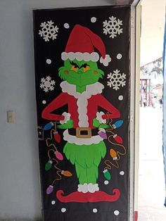 a door decorated with an image of the grinch