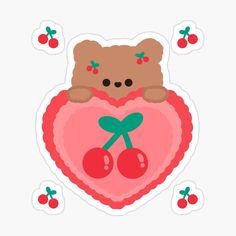 a teddy bear holding a heart with cherries on it