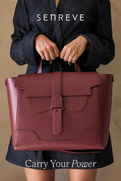 Woman in dark denim dress holds a wine-red leather laptop-sized work satchel by the top handle. Senreve Maestra, Handbags For Work, Best Work Bag, Busy Girl, Dream Wishlist, Xmas Wishlist, Leather Ideas, Day At The Office, Stylish Handbags