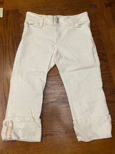 These are a pair of GAP ladies low rise stretch cropped/capri jeans, size 10.  The color is white.   The inseam is approx 20".  The waist is approx 18" from side to side.  The cuff is approx 4".  They are 99% cotton, 1% spandex. I think I got these in the 90's.  I rarely wore them cause of them being white, but there are cute! White Mid-rise Capris For Summer, White Straight Leg Capris With Pockets, White Straight-leg Capris With Pockets, White Straight Leg Casual Capris, Stretch Cotton Capri Jeans, Stretch Cotton Capri Length Jeans, Stretch Cotton Capri-length Jeans, Casual White Mid-rise Capris, White Cotton Capris