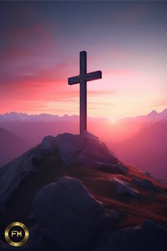 a cross on top of a mountain at sunset