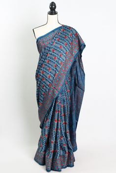 Add a touch of timeless elegance to your wardrobe with our Hand Printed Ajrakh Saree on Modal Silk in Blue. This stunning saree features intricate traditional Ajrakh printing and is crafted from luxurious modal silk fabric, making it a statement piece for any special occasion. The beautiful blue hue adds a pop of color to your ensemble, while the soft and smooth texture of the modal silk ensures utmost comfort. Each saree is meticulously hand printed by skilled artisans, making it a truly unique Blue Chanderi Pre-draped Saree With Motifs, Bohemian Handloom Pre-draped Saree, Bohemian Traditional Wear With Bandhani Print In Mulmul, Bohemian Chanderi Block Print Pre-draped Saree, Traditional Drape Mulmul Traditional Wear With Kalamkari Print, Traditional Mulmul Kalamkari Print Wear, Bohemian Cotton Silk Pre-draped Saree, Traditional Mulmul Kalamkari Wear, Blue Cotton Silk Traditional Wear With Kalamkari Print