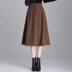 • High Waist Design :The high waist design of this brown wool skirt accentuates the waistline, creating a flattering silhouette for any body type. • Loose A-line Cut :The loose A-line cut offers a comfortable fit while adding a touch of elegance to your outfit. Perfect for commuting or casual outings. • 2023 Autumn and Winter Collection :Part of our 2023 Autumn and Winter collection, this skirt is designed to keep you warm and stylish in the colder months. • Mainland China Origin :Originating from Mainland China, this skirt reflects the countrys rich textile heritage, ensuring high-quality craftsmanship. • Elegant Commuting Hip :This skirts elegant commuting hip style makes it a versatile addition to any wardrobe, suitable for both work and leisure activities. • Small Size :Its small size High Waist Brown Skirt, High Waist Brown Skirt With Pockets, Fall High Waist Solid Skirt, Brown Skirt For Fall, Solid High Waist Skirt For Fall, Fitted Brown Skirt Solid Color, Fitted Solid Brown Skirt, Fitted Solid Color Brown Skirt, High Waist Fall Skirt