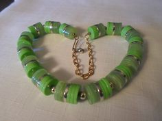 "Colored in bright lime green and translucent celery green, this funky Lucite necklace is very lightweight to wear. Measuring 17\" long (including extender,) the width of the piece is 5/8\". Gold-tone spacer beads, chain and findings complete the choker. Looking the same on both sides, it won't matter which way you put this on. Highly-collectible, this bib is in excellent vintage condition!" Green Choker Necklace, Neon Jewelry, Green Choker, Modernist Art, Lucite Jewelry, Vintage Necklaces, Green Jewelry, Vintage Lucite, Jewelry Choker