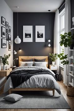 a bedroom with black walls and white bedding, potted plants and pictures on the wall