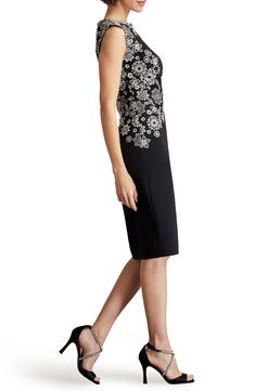 Embroidered floral lace echoes from the yoke to the waist of this elegant sheath dress that'll have you raising a glass in chic style. 40 1/2" length (size 8) Hidden back-zip closure Jewel neck Sleevleess Lined 95% polyester, 5% spandex with 80% polyester, 20% nylon contrast Hand wash, line dry Imported Formal Floral Embroidered Dresses, Elegant Floral Embellished Midi Dress For Gala, Elegant Sheath Dress With Lace Trim, Elegant Floral Embroidery Lace Dress For Formal Occasions, Elegant Floral Embroidery Lace Dress, Elegant Knee-length Floral Embroidered Lace Dress, Elegant Fitted Lace Dress With Floral Embroidery, Elegant Knee-length Lace Dress With Floral Embroidery, Elegant Floral Lace Dresses