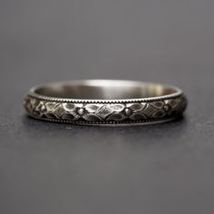 an antique wedding band is shown on a table