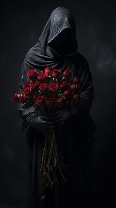 a person in a black robe holding a bunch of red roses with the hood on