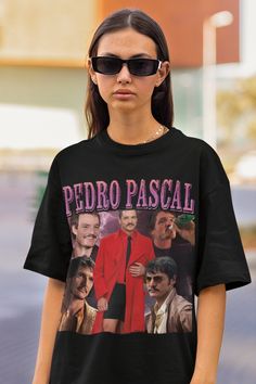 "If you want the t-shirt to look like the model,we suggest you to buy it 1-2 size bigger than your regular size. PEDRO PASCAL tee 🎉 Key Features: -High-quality, soft, and comfortable cotton fabric. -A vintage Oversize T-shirt -Available in various sizes to ensure a perfect fit for everyone. -%100 Cotton HOW TO ORDER: 1-Browse all pictures. 2- Mark your \"Size\" and \"Color\" selections from the drop-down menus. 3- Choose your quantity. 4-You can continue your payment process by clicking the \"A 90s Inspired Short Sleeve T-shirt For Fans, 90s Style Crew Neck T-shirt With Character Print, 90s Inspired Short Sleeve T-shirt With Sublimation Print, 90s Inspired Sublimation Print Short Sleeve T-shirt, 90s Crew Neck T-shirt With Character Print, 90s Character Print Crew Neck T-shirt, Celebrity Shirts, Love You Cute, Movie Tees