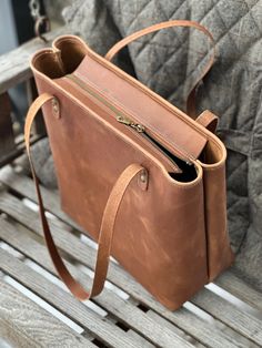 "CUSTOMIZABLE LARGE Genuine Leather Tote Bag *LIFETIME WARRANTY* STANDARD options: *Large size! ~13H\" x ~15W\" x ~6.25\" open top * NEW! ZIPPERED TOP *Rolled Top  *10\" drop shoulder strap *1 interior pocket (doubles as 2) DELUXE options: * NEW ZIPPER TOP!! *2 inner pockets (1 zippered, 1 open) *Feet (5 of the hardware color you choose) *Keychain Strap w/ fob *Choose shoulder strap leather Handmade in Potter Co. PA in my little sew shop ~B." Classic Tote Shoulder Bag As Gift, Large Capacity Tote Bag For Personal Use, Classic Handmade Bag For Daily Use, Classic Handmade Bags For Daily Use, Satchel Bag With Zipper Pocket, Classic Handmade Bags For Everyday Use, Classic Handmade Satchel For Everyday, Gift Tote Bag With Zipper Pocket, Modern Bag With Zipper Pocket For Gift