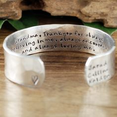 "Take a LOOK at our Website: ANNIEREH.com Personalized Grandma Bracelet, Grandmother Cuff Bracelet, Grandchildren's Names, Mothers Day Gift, Gift for Grandma,Christmas Gift for Her Customize our cuff bracelets with your favorite word/s, meaningful phrase, special saying, names of loved ones, grandchildren, dates and even coordinates for the place you met your partner or shared a special moment with someone. Let us know the Names/Wording for this cuff in our NOTE to seller box. We can also person Mother's Day Engraved Bangle For Personalized Gift, Engraved Bangle For Personalized Mother's Day Gift, Engraved Bangle For Mother's Day Personalized Gift, Mother's Day Engraved Adjustable Name Bracelet, Personalized Name Bracelets For Mother's Day, Name Bracelets For Mother's Day Gift, Name Bracelets As Mother's Day Gifts, Adjustable Engraved Bracelet For Mom, Personalized Bangle For Anniversary And Mother's Day