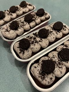 three tins filled with cookies and oreo cookies