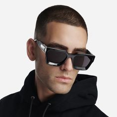 Elevate your style with our "Baller" sunglasses. These shades, in bold black with silver detailing, a GC logo, and unique Guilloché pattern sides, make a statement that reflects your individuality and unmatched confidence. Step out in sophistication and leave a lasting impression. MATERIAL Pure black Acetate frame with silver metal detailing UV 100% UVA/UVB Protection WEIGHT 70 g SIZE 56 □ 20 - 145 INCLUDED IN THE BOX Lens cleaning cloth, soft leather case Futuristic Sunglasses With Mirrored Lenses For Streetwear, Futuristic Mirrored Sunglasses For Streetwear, Wayfarer Sunglasses With Gradient Lenses For Streetwear, Black Wayfarer Sunglasses For Streetwear, Futuristic Sunglasses With Gradient Lenses For Parties, Black Anti-reflective Sunglasses For Streetwear, Black Sunglasses With Uva Protection For Streetwear, Futuristic Anti-reflective Sunglasses For Streetwear, Polarized Cat Eye Sunglasses For Streetwear