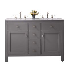 a double sink vanity with two faucets and marble counter top in grey color