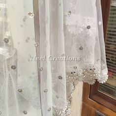 Silver sequin motifs on net. Indian dupatta. Net dupatta with scallop border. Custom made dupattas More dupatta here in our collection https://www.etsy.com/shop/neelcreations/?section_id=15880219 This Dupatta is embroidered on net with beautiful Scallop silver border. This can be your wedding dress chunni. Border has beautiful work of faux pearls, mirrors and kundan. ★ It can be made in other colors. ★We can increase the length if required. Approximate length 90-95 inches. We can increase length Sequin Traditional Drape Dupatta For Festivals, Traditional Drape Sequined Dupatta For Festivals, Traditional Sequined Dupatta For Weddings, Traditional Draped Sequin Dupatta For Festivals, Traditional Wedding Dupatta With Sequins, Wedding Dupatta With Sequins In Traditional Drape, Bollywood Style Sequined Dupatta For Wedding, Semi-stitched Silver Organza Dupatta, Silver Organza Dupatta With Resham Embroidery