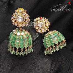 Silver Moissanite Polki Emerald Jhumka, Polki Kundan Earring, Indian Wedding Jewelery, Moissanite Polki Jhumki, Big Jhumka, Bridal Earring Material : Silver Gemstone: Moissanite , Swarovski Stones Stone colour: Uncut Polki Primary colour: Gold Size-Length: 55mm Width: 35mm Closure : Screw back and Clips Silver Intricate, hand crafted, Pure Silver Polki Jhumka, studded with high quality Moissanite Polki Earring comes with screw back and clips, made in 92.5 silver with 22ct gold plating. Product c Green Fusion Bridal Earrings With Hand Set, Fusion Style Kundan Bridal Earrings For Reception, Green Meenakari Bridal Earrings For Reception, Fusion Style Wedding Jhumkas For Festivals, Green Bridal Earrings For Reception On Diwali, Green Bridal Earrings For Reception During Diwali, Green Bridal Earrings For Reception At Diwali, Fusion Style Wedding Danglers With Cutdana, Fusion Style Cutdana Danglers For Wedding