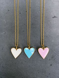 Sterling vermeil enamel heart charm necklace. Necklace is 18" in length. 18KT gold plate over sterling silver on heart charm and cable chain. Heart charm measures 14 mm x 17 mm. Available in three colors, choose from drop down menu. Follow us on instagram @pennyweightsjewelry! Heart-shaped Enamel Charms Necklaces, Heart-shaped Enamel Charms Necklace, Enamel Heart Charms Necklace, Enamel Heart Charm Necklace For Gifts, Gold Heart-shaped Enamel Necklace, Heart-shaped Gold Enamel Necklace, Gold Enamel Charm Necklace With Heart Charm, Gold Enamel Heart Charm Necklace, Chain Heart