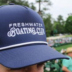 Join the club, mate.Our Freshwater Boating Club Premium Rope Hat is now available with a new design and color! This is the perfect unisex, mid-profile hat and features an embroidered design, white rope detail, a slight-curved visor and adjustable snapback.DETAILS: - Trucker hat is sold individually- One size available, adjustable bag- Designed exclusively for Freshwater- Polyester/spandex woven- 5-panel- Slight curved visor- Pro-stitched finish- Contrast color cording- Snapback adjustable- Mid-P Curved Brim Baseball Cap For Summer Golf, Summer Golf Baseball Cap, Summer Golf Hats With Curved Brim, Summer Golf Hat With Curved Brim, Curved Brim Golf Hats For Summer, Summer Sports Baseball Cap With Flat Brim, Summer Sports Events Baseball Cap With Flat Brim, Summer Snapback Hat For Sports Events With Flat Brim, Summer Sports Snapback Hat With Flat Brim