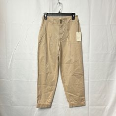 A. New Day Women’s Stretch Pants Color Tan Spring Khaki High-waisted Work Pants, Spring Khaki Ankle-length Chinos, Beige Work Pants With Pockets For Spring, Spring Beige Work Pants With Pockets, Beige Relaxed Fit Work Pants For Spring, Spring High-waisted Chinos, Tapered High Waist Pants For Spring, Spring Beige Tapered Leg Chinos, Casual High Waist Spring Chinos