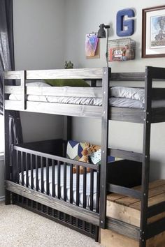 a bunk bed sitting next to a window in a bedroom