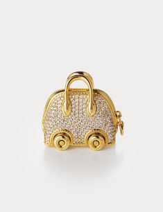 Inspired by Hermes Bolide On Wheels Bag Charm, Aelysee has meticulously crafted the Mini Bolide On Wheels Bag Charm, incorporating unique design elements. The charm features a separate clasp and chain, allowing you to customize it effortlessly with any of your handbags. Electroplated brass with round brilliant Zircon Charm size - 30 x 18.3 x 28.8mm Total weight 38g One year warranty