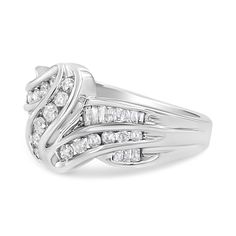 Natural diamonds and gleaming gold interlock each other to create this eye-catching bypass ring design. Created in shining 10k white gold, this ring will sit so elegantly on your finger and sparkle with 3/4 carats of diamonds. An assortment of round and baguette-cut diamonds adorn this piece, and will give all your outfits a dazzling effect. Fine Ring, Bypass Ring, Bridal Bands, Baguette Cut Diamond, Diamond Rings Bands, Bracelet Collection, Fine Earrings, White Gold Ring, Baguette Diamond