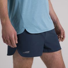 It’s light, it’s breathable, and it’s ready to go fast. The Vanish 2” Short is made from recycled, moisture wicking, stretch woven material and features a brief liner. Chase some speed with this short designed for performance, featuring an invisible zip pocket to hold your necessities and an interior draw cord for the perfect fit. Whether you’re tackling a speed workout or toeing the line at a race, these shorts were made to help you perform. | Altra Running Men's Vanish 2" Short in Navy, Size: Speed Workout, Smartwool Socks, Running Apparel, Running Man, Invisible Zip, Line At, Gym Training, Running Clothes, Designer Shorts