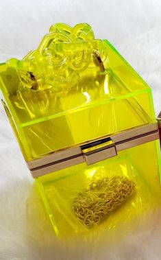 Classy yet edgy box clutch. Accessorized with color matted chain link. Clear silhouette. Dimensions 4"W x 5 1/8" H x 4" D Square Handbag, Jogging Suits, Jolly Rancher, Yellow Handbag, Box Clutch, Envelope Bag, Tropical Vibes, Weekend Vibes, Vintage Handbags