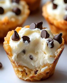 chocolate chip cookie cupcakes with cream frosting and chocolate chips