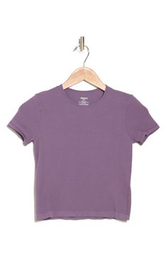 An essential for endless outfits, this baby tee is made from stretchy ribbed fabric that creates a figure-hugging fit. Crewneck Short sleeves 93% nylon, 7% spandex Machine wash, line dry Imported Fitted Basic Ribbed T-shirt, Everyday Ribbed T-shirt, Basic Seamless Snug Fit T-shirt, Basic Solid T-shirt With Snug Fit, Basic Snug Fit Seamless T-shirt, Solid Ribbed T-shirt For Layering, Seamless Stretch Crew Neck T-shirt, Solid Short Sleeve Seamless Stretch Top, Stretch Seamless Solid Short Sleeve Top