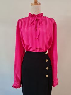 Right On by Remona Melbourne, Fuschia pink self stripe long sleeved jacquard blouse with ruffles at neckline and cuff. Button through with button cuff and simple rouleau mock bow at neckline.  She's marked a fabulous plus size 20, but see measurements below to check on actual sizing (closer to an 18). Fuschia Pink  100% Polyester Very Good Condition Body Length from HPS -  71cm  Sleeve length from CB Neck - 79cm   Shoulder width - 45cm  Bust - 62cm  Hip - 62cm Follow us on Instagram @packratt_vi Elegant Long Sleeve Pink Blouse, Elegant Pink Long Sleeve Blouse, Chic Pink Formal Blouse, Elegant Pink Tie Neck Top, Pink Formal Blouse For Fall, Formal Pink Blouse For Fall, Chic Long Sleeve Pink Blouse, Chic Pink Long Sleeve Blouse, Pink Ruffled Tops For Formal Occasions