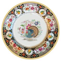 a decorative plate with an image of a rooster on it