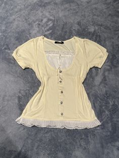 Cream/light yellow two in one milkmaid women's blouse top -Preloved, in good condition, there are obvious signs of use -Japanese label, bust:79-87cm, length:54cm -Best fits uk6-8 dollete coquette balletcore kawaii harajuku dollcore fairy female jfashion grunge fatal gyaru Fitted Cream Cute Tops, Cute Fitted Cream Tops, Cute Fitted Ruffle Tops, Fitted Lace Trim T-shirt For Summer, Cute Fitted Puff Sleeve Tops, Fitted Cream Tops With Ruffles, Fitted Y2k Tops With Lace Trim, Fitted Puff Sleeve T-shirt For Spring, Feminine Fitted Short Sleeve Tops