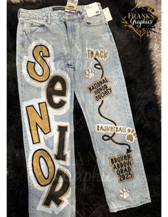 Hand Painted and custom tailored to your schools colors or favorite colors for your photo shoot! Diy Senior Jeans, Spirit Week Jeans, Senior Pants Ideas, Senior Jeans Painted, Custom Painted Jeans, Hoco Jeans, Senior Painted Jeans, Paint Pants, Senior Pants