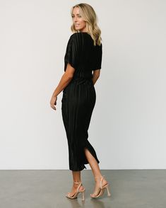 Elevate your elegance with our black pleated sleeveless maxi dress, a captivating choice that exudes timeless beauty. This dress, with its graceful pleats and rich black hue, ensures you stand out with sophistication and style at any special event. Black Midi Dress With Split Hem For Spring, Elegant Black Midi Dress With Split Hem, Black Maxi Dress With Split Hem For Spring, Black Midi Dress With Pleated Back, Black Midi Dress With Side Slits For Work, Black Midi Dress With Split Hem For Night Out, Black Dress With Side Slits For Work, Black Workwear Dress With Side Slits, Black Work Dresses With Side Slits