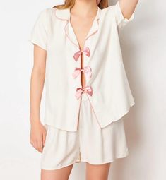 🌙 Slip into comfort with our White Pajama Set featuring an adorable Pink Bow 🎀. Perfect for a cozy night's sleep 🛌 or lounging around the house 🏠. Soft, breathable fabric ensures you stay comfortable all night long 🌟. Add a touch of elegance and fun to your nighttime routine with this charming set! 💕 Hello, Thank you for choosing to shop with us on Etsy! We appreciate your support and are thrilled to be able to provide you with unique and beautiful watches. We understand that keeping you informed about the shipping process is essential, so we want to assure you that we are committed to ensuring a smooth and timely delivery. Once your order is placed, our team works diligently to process it as quickly as possible. We carefully package each item to ensure its safety during transit. Onc Pink Sets For Relaxation In Summer, Pink Relaxation Sets For Summer, Pink Summer Relaxation Sets, White Short Sets For Daywear, Feminine White Pajama Shorts For Pajama Party, Feminine White Pajama Shorts For Loungewear, Pink Short Set For Loungewear, White Summer Sleep Short Set, White Short Sets For Loungewear