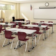 an empty classroom with desks and chairs