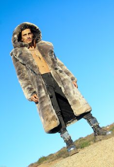 MENS’S VANDAL COAT FEATURES High quality Tissavel Chinchilla faux fur. ** Limited Edition Fur. Lined with super soft cuddle minky fabric. 2 Deep zipper pockets on the inside front sides (large enough for a water bottle). 6" Invisible ID pocket on the inside left chest lining. Two outside pockets to keep your hands warm. Inside back pack straps to wear the coat like a backpack when you are hot. Zip-off fur hood. Front button closure and button at hood to close the front of the coat over to cover Festival Coats, Chinchilla Fur, Vest Coat, Fur Hood, High Five, Music Festivals, Winter Coats, Minky Fabric, Comfy Cozy