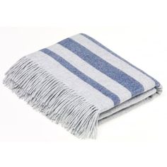 a gray and white striped blanket on a white background with fringes in the middle