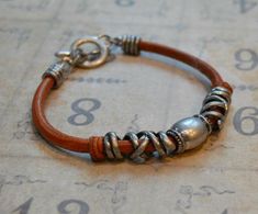 This distressed leather wrap bracelet is a perfect gift for Dads.However the design is UNISEX and can be worn by both men and women. Material: Top grain leather Color: light brown tanClosure: toggle claspLength: 7.5" totalWidth: 10-15mm Leather Wrap Bracelet, Distressed Leather, Top Grain Leather, Leather Wraps, Tan Leather, Making Ideas, Wrap Bracelet, Jewelry Inspiration, Mens Bracelet