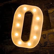 a light up letter that is sitting on a table