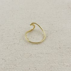 Embody the ocean's eternal movement with our enchanting Wave Ring. Featuring fluid lines that mirror gentle ocean ripples, this elegant piece brings natural rhythm to your collection. The continuous wave pattern creates a mesmerizing three-dimensional effect that catches light beautifully as it moves. Perfect for beach lovers and those drawn to coastal beauty, this ring serves as a wearable reminder of the sea's timeless allure. Whether worn alone or stacked, it adds a touch of maritime charm to Ocean Ripples, Croissant Earrings, Croissant Ring, Hand Chain Bracelet, 18k Gold Chain, Pearl Shop, Wave Ring, Hypoallergenic Jewelry, Zodiac Necklaces