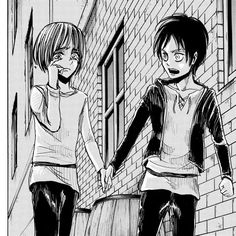 two girls walking down the street holding hands