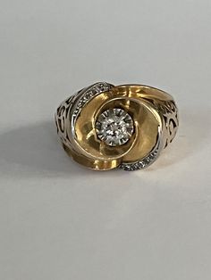 Art Deco ring in yellow gold (18k) animated adorned with diamonds. Tray diameter: 15 mm Gross Weight: 9.90g. Size: 53 Possibility of resizing, contact us. Further information : We issue an invoice as well as a certificate of authenticity established by our qualified gemologist (LFG Paris). Our photos are not reworked and are taken in a natural light environment. We can send you a short video on request. Each jewel is delivered in a box. Each shipment is made with insurance and tracking number. Free delivery in metropolitan France Deco Ring, Art Deco Ring, Multi Stone Ring, Gold Diamond Rings, Short Video, In A Box, Diamond Rings, Tracking Number, Natural Light