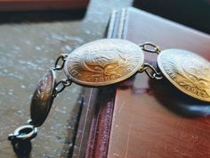 "Men's Silver Concho Bracelet Antique Peruvian 1870-1912 Peru Peruvian Dinero Sol .900 Silver Coin 8\" Silver Bracelet. 23mm wide. Adjustable by adding or removing the sterling silver split rings as shown. The coins that were used to Make This handsome antique men's Concho bracelet were Minted in Peru from 1879 until 1912. The Bracelet has a total weight of 30.5 grams. This is an all-original, antique Peruvian silver 23mm authentic Peru 1/5 Sol coin Concho bracelet Bracelet. Coin bracelet has be Antique Engraved Round Bracelets, Vintage Antique Silver Stamped Bracelets, Antique Stamped Bracelets For Formal Occasions, Vintage Engraved Antique Silver Bracelets, Vintage Antique Silver Stamped Bracelet, Victorian Engraved Bracelets Collectible, Vintage Engraved Antique Silver Bracelet, Heirloom Engraved Bracelets, Heirloom Engraved Bracelets For Collectors