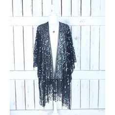 Sheer Black Net Round Black Sequin Fringe Tassel Kimono Cardigan Cover Up Measurements...Taken Flat -Size: One Size -Width Seam To Seam: 46" -Length With Fringe: 35" Features - Lightweight Sheer Black Net -Accented With Round Black Sequin -Scalloped Edges -Fringe Hem -Bohemian Gypsy Oversized Flowing Style -Generous Arm Holes Chic Sequined Cardigan, Chic Black V-neck Kimono, Bohemian V-neck Kimono For Party, Elegant Black Fringe Outerwear, Bohemian Fitted Cardigan For Party, Chic Fringe Cardigan, Black Shawl Outerwear For Festival, Spring Black Tasseled Outerwear, Elegant Fall Party Kimono