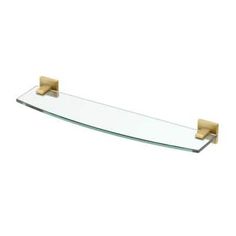 glass shelf with gold metal brackets