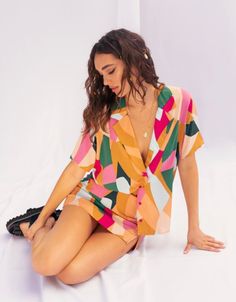 Stand out in style with this unique colorful button up blouse. Rayon Imported Vibrant V-neck Blouse For Day Out, Multicolor V-neck Shirt With Button Closure, Trendy Multicolor Print Button-up Blouse, Multicolor V-neck Color Block Blouse, Trendy V-neck Blouse With Vibrant Print, Trendy Multicolor Shirt With Vibrant Print, Summer Shirt With Multicolor Print And Colorful Pattern, Multicolor V-neck Shirt For Summer, Multicolor V-neck Summer Shirt