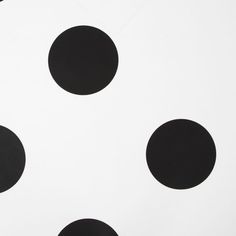 black and white polka dots are arranged on the surface