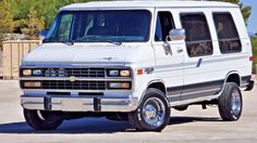 a white van parked in a parking lot